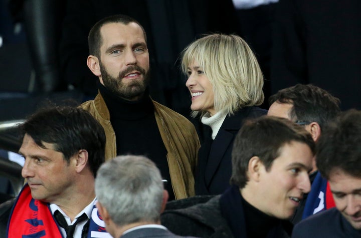 Robin Wright and Clement Giraudet attend the UEFA Champions League Round of 16 Second Leg match between Paris Saint-Germain and Real Madrid at Parc des Princes stadium on March 6, 2018, in Paris.