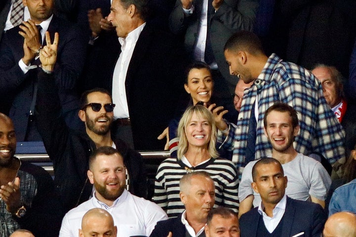 Robin Wright, Clement Giraudet and Hopper Penn during a soccer match in Paris on Sept. 27, 2017. Kourtney Kardashian and her ex-boyfriend Younes Bendjima sat behind the trio.