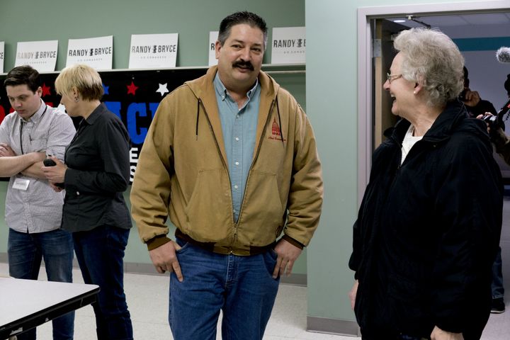 Randy Bryce speaks with a campaign volunteer at an event in Kenosha, Wisconsin, in April.