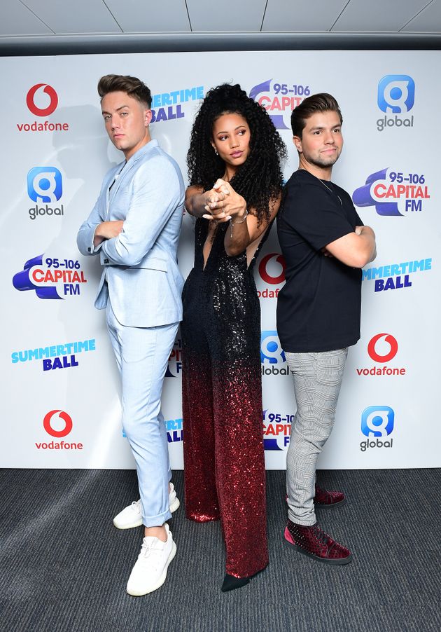 Vick with her Capital Radio co-hosts Roman Kemp and Sonny Jay