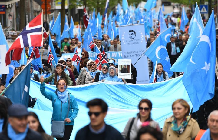 Ethnic Uighurs take part in a protest march near European Union offices in Brussels on April 27.