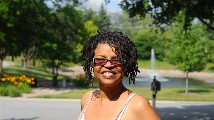 Sandra Finley outside her home in Olympia Fields, Illinois, with a nearby fountain that inspires her. “Peace is here. Beauty 