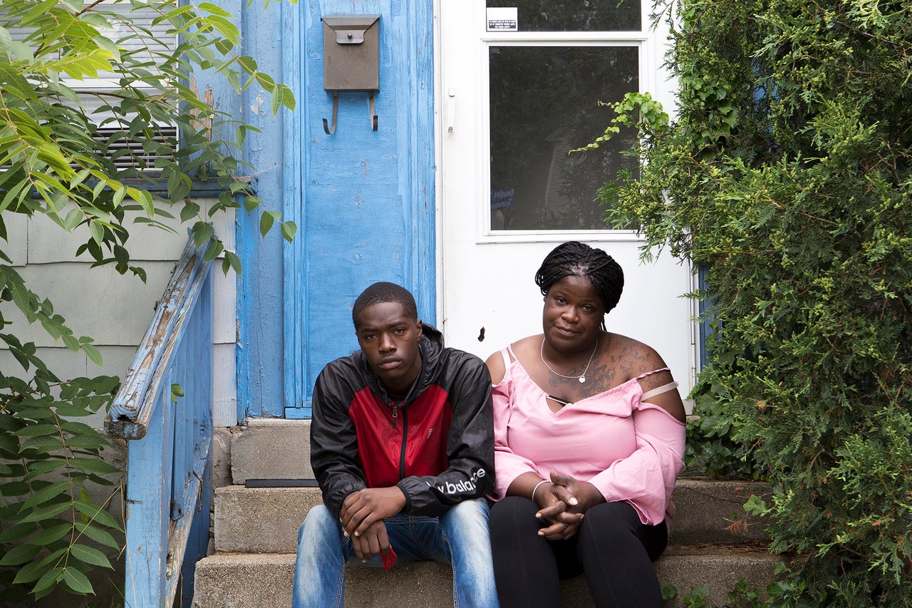 Jones and his mother pose for a portrait at their home in Kalamazoo.