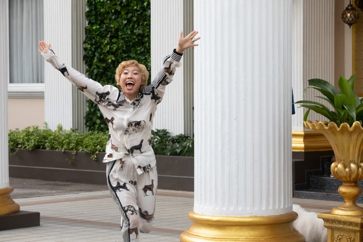 Peik Lin, played by Awkwafina, wearing a silk pajama-inspired ensemble by Stella McCartney. 