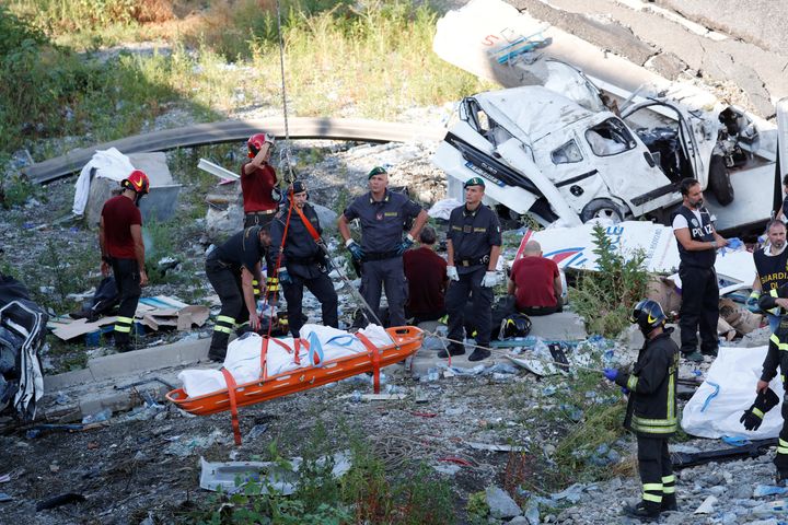 Rescue workers recover a body at the site of the collapsed Morandi Bridge in the Italian port city of Genoa, Italy.