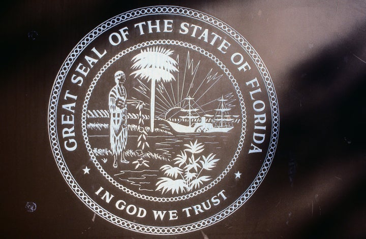 “In God We Trust” has been Florida's state motto since 2006. It is now mandatory to display in all public schools.