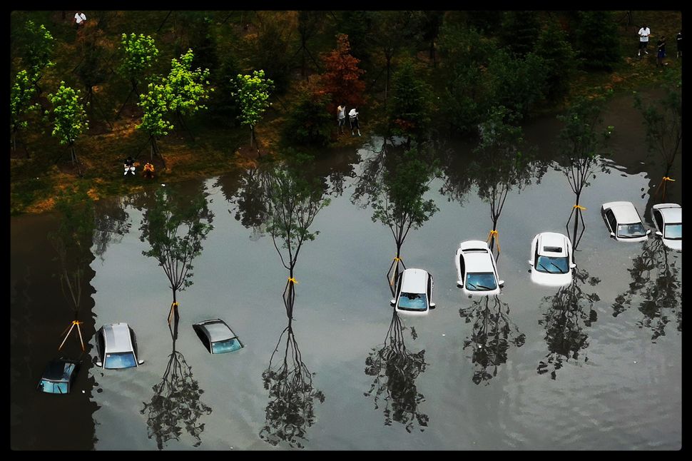 Cars were nearly fully submerged in Shenyang in 7 August.
