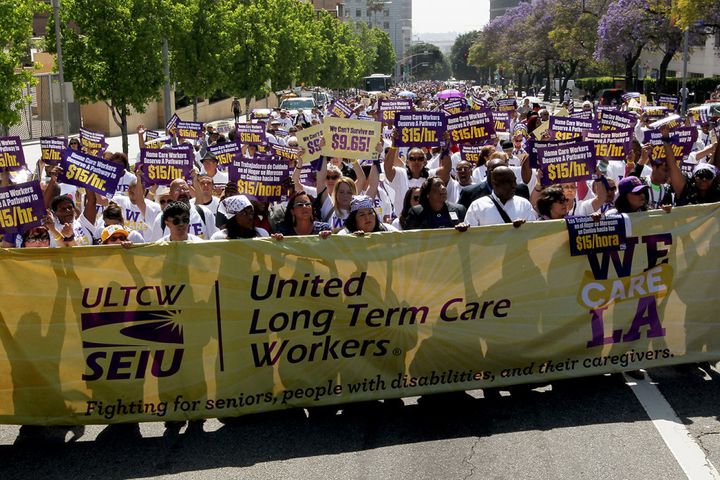 Home care workers march in Los Angeles in April 2015 calling for a minimum wage hike.