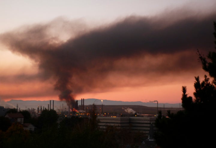 A plume of smoke emits from a fire that broke out at a Chevron oil refinery in Richmond, California August 6, 2012. 