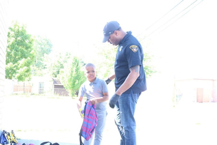 Jermaine Smith serves his community as both a barbershop owner and a police officer.