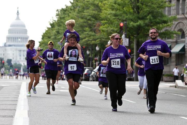 Runners approach the finish line at the Pancreatic Cancer Action Network's PurpleStride 5K Run/Walk on June 16, 2012.