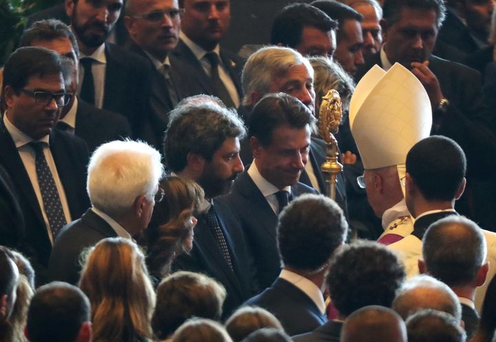 Italian Prime Minister Giuseppe Conte and Archbishop of Genoa, Cardinal Angelo Bagnasco, are seen at the end of the state funeral of the victims of the Morandi Bridge collapse.