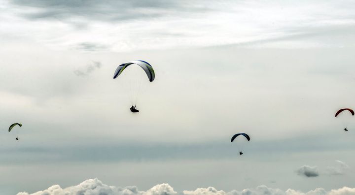 A British paraglider was killed after a mid-air collision with another pilot.