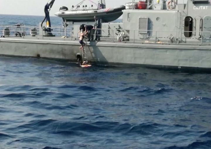 The woman being rescued by the Croatian coast guard vessel.
