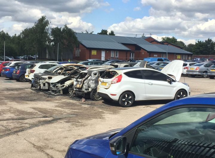 Burned out vehicles in the car park of HMP Birmingham Prison 