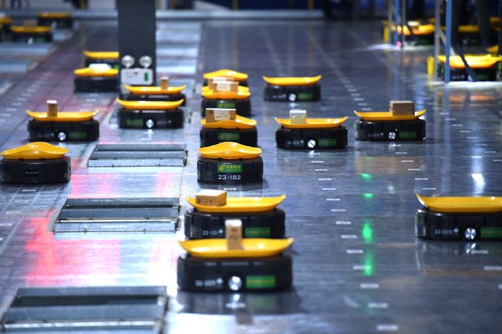 'Minions' intelligent sorting robots work at a warehouse on November 9, 2017 in Hefei, Anhui Province of China.