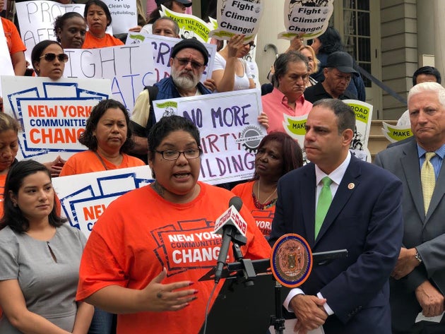 Rachel Rivera speaks at Monday's press conference, while Councilman Costa Constantinides stands to her