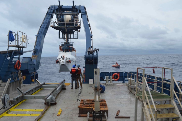 The deep-sea submersible Alvin is launched from R/V Atlantis off the coast of Delaware on Monday. A research team has planned 12 dives over the next two weeks to explore and study deep ocean ecosystems off the southeast coast.