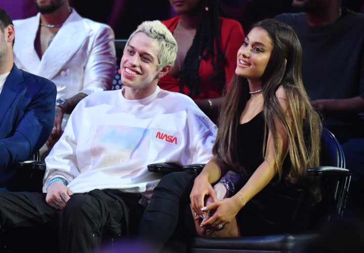 Pete Davidson and Ariana Grande take in the show together. 