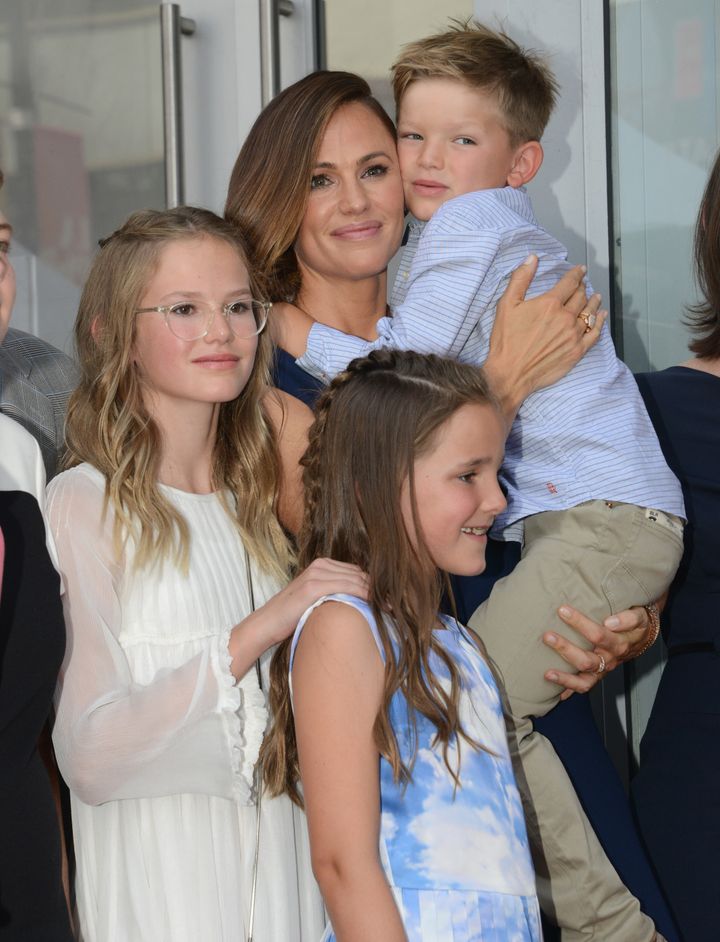 Garner poses with children Violet, Samuel and Seraphina during the Hollywood Walk of Fame ceremony.