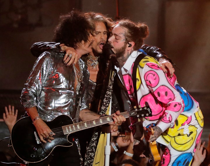 Post Malone performs with Joe Perry and Steven Tyler during the MTV Video Music Awards on Monday.