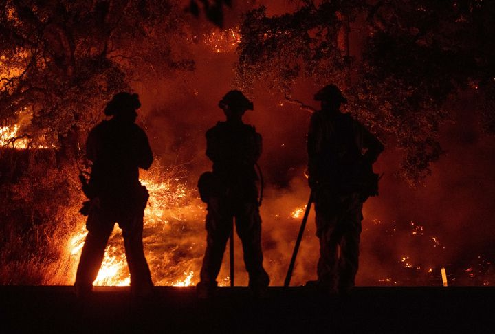 Firefighters watch a back burn during the Mendocino Complex fire in Upper Lake, California, on July 31.