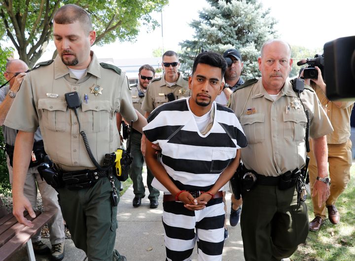 Cristhian Rivera is escorted into the Poweshiek County Courthouse for his initial court appearance on Aug. 22, 2018, in Montezuma, Iowa.