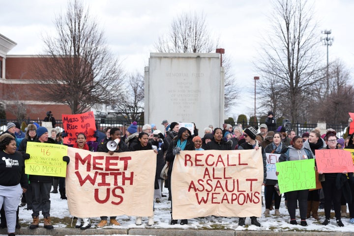 Students, educators and faith leaders hold a rally in front of Smith & Wesson world headquarters in Springfield, Massachu