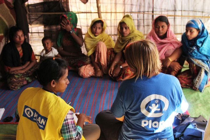 Girls attend a menstrual hygiene training session in the camp