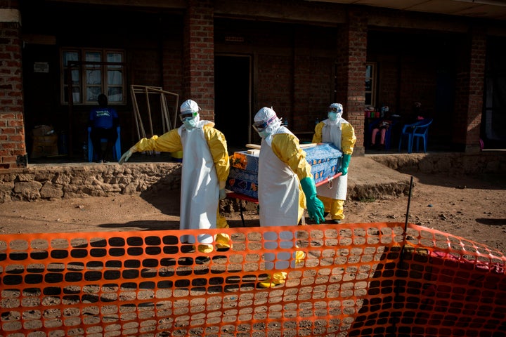 Medical workers carry the corpse of an unconfirmed Ebola case on Aug. 13, 2018, in the city of Beni in the Democratic Republic of Congo.