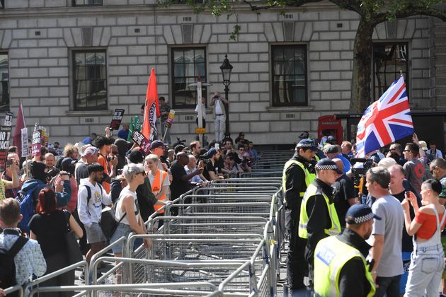 A demonstration by the Democratic Football Lads Alliance (right) and a counter protest near the Cenotaph, in Whitehall, London.