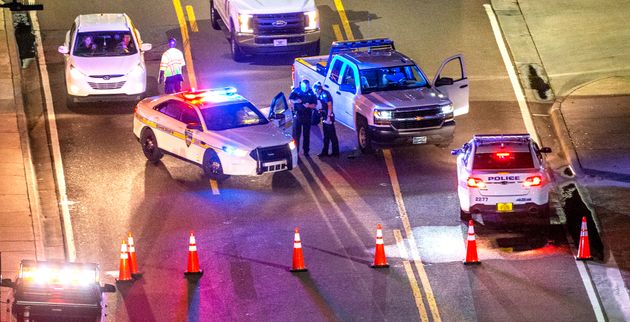 A heavy police presence remains into the night at the shooting outside Jacksonville Landing on August 26, 2018 in Jacksonville, Florida.