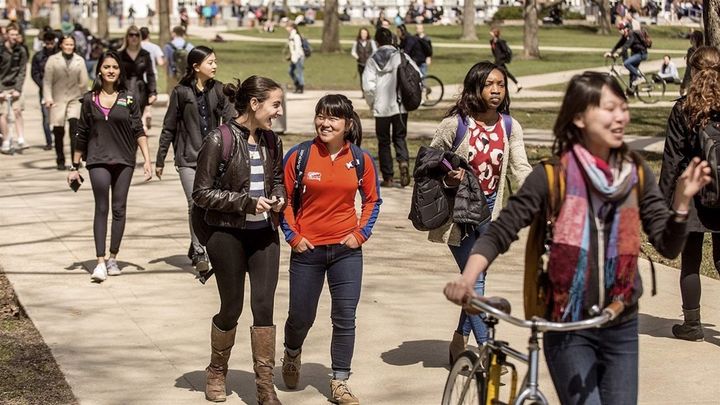 <p>Students walk across the University of Illinois campus in Urbana. Colleges that have been magnets for international students have seen application and enrollment numbers for such students dip in recent years. </p>