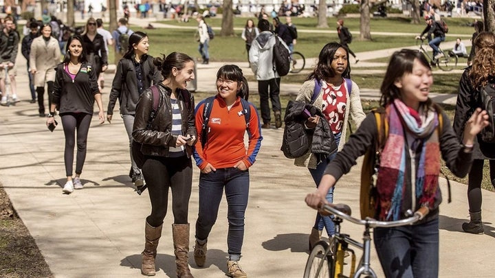 <p>Students walk across the University of Illinois campus in Urbana. Colleges that have been magnets for international students have seen application and enrollment numbers for such students dip in recent years. </p>