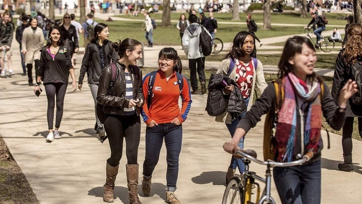 Students walk across the University of Illinois campus in Urbana. Colleges that have been magnets for international students have seen application and enrollment numbers for such students dip in recent years. 