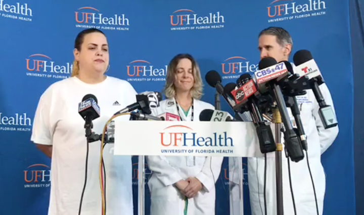 Sujeil Lopez (far left), Timothy Anselimo’s mother, speaks at a press conference the day after he was shot at an esports tournament in Jacksonville, Florida, on Aug. 26.