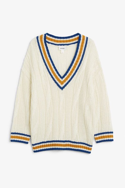 What is best known for being worn on the cricket field, is now cute tucked into some <a href="https://www.huffingtonpost.co.uk/entry/corduroy-style-guide_uk_5a6b2b4be4b0ddb658c5a5fb">corduroy trousers</a> and with no blouse underneath. This thick option will make you feel as though you're in a heated cloud - as of course autumn should feel, (<a href="https://www.monki.com/en_gbp/clothing/knitwear/product.knitted-contrast-sweater-white-contrast.0682297001.html" target="_blank" rel="noopener noreferrer">Monki</a>, size XS-XL available &pound;35).