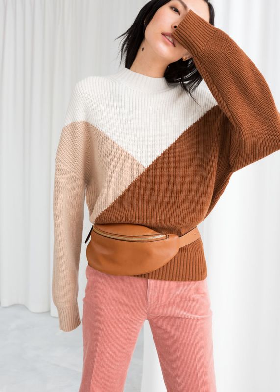 Picture a long autumnal walk: the leaves are falling, the air is crisp, the dog walkers are out in numbers. If autumn was a knit, this would be it, (<a href="https://www.stories.com/en_gbp/clothing/knitwear/product.colour-block-sweater-beige.0543304002.html" target="_blank" rel="noopener noreferrer">Other Stories</a>, size XS-L, &pound;69).