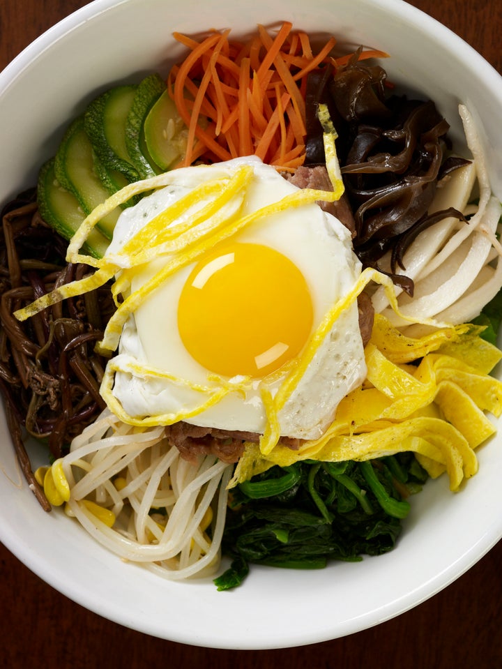 Bibimbap with fried egg and vegetables. 