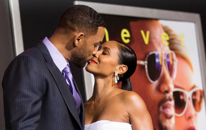 Will Smith and Jada Pinkett Smith kiss at the premiere of "Focus" in Hollywood on Feb. 24, 2015. 