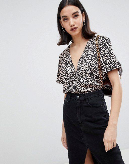 This animal print blouse is GUG also known as grown-up goth. The button smartens up the top but it's also the easiest option to dress up or down. (<a href="http://www.asos.com/asos-design/asos-design-boxy-top-with-contrast-buttons-in-animal-print/prd/10574155?clr=multi&SearchQuery=animal%20print&gridcolumn=1&gridrow=1&gridsize=4&pge=1&pgesize=72&totalstyles=824" target="_blank" rel="noopener noreferrer">ASOS</a>, size 4-18 available, £28)