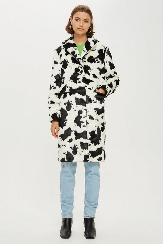 A monochromatic cow print coat is the modern statement you probably didn't think you'd see. This cosy coat will keep you cool, collected and ahead of the trend. (<a href="http://www.topshop.com/en/tsuk/product/clothing-427/trend-animal-print-7513510/cow-print-coat-7925807" target="_blank" rel="noopener noreferrer">TopShop</a>, size 4-16 available, £95)