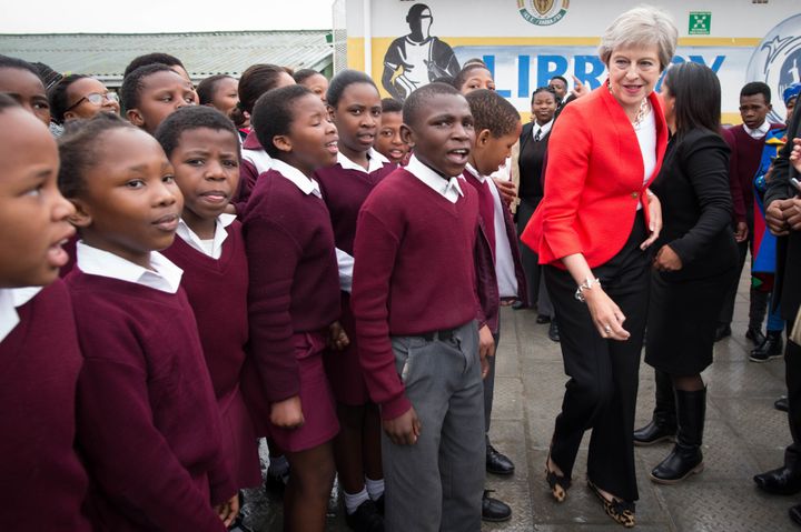 Theresa May meets students at a secondary school in Cape Town, South Africa