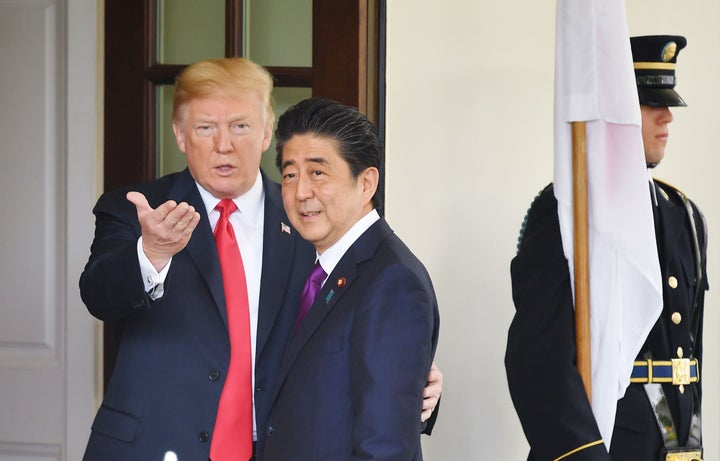 President Donald Trump greets Japanese Prime Minister Shinzo Abe upon his arrival at the White House on June 7.