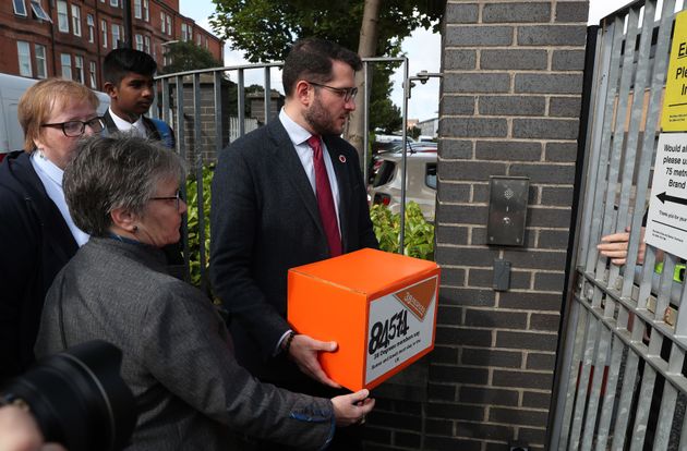 Paul Sweeney MP hands over the petition