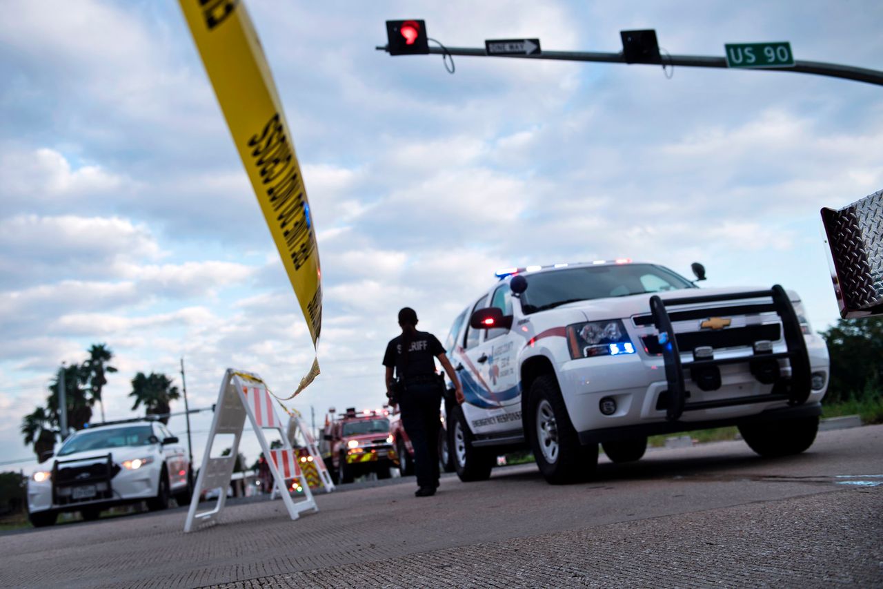Emergency vehicles wait at a roadblock in Crosby, Texas, after the Arkema plant explosion.