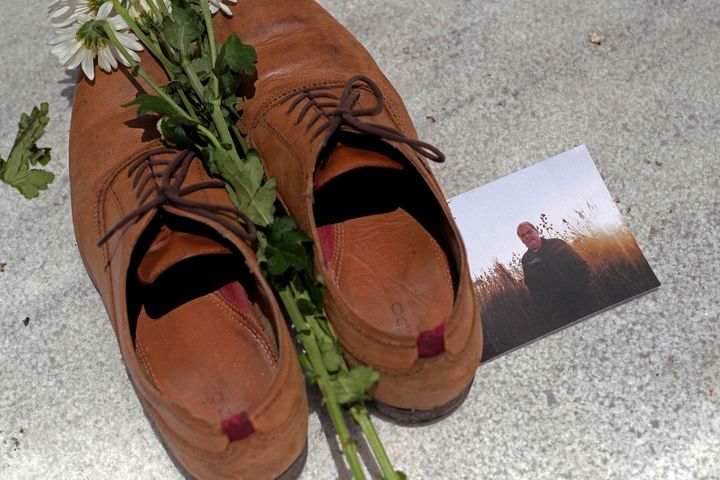 A photo of Luis Manuel Vazquez among the shoes at the Capitol in San Juan.