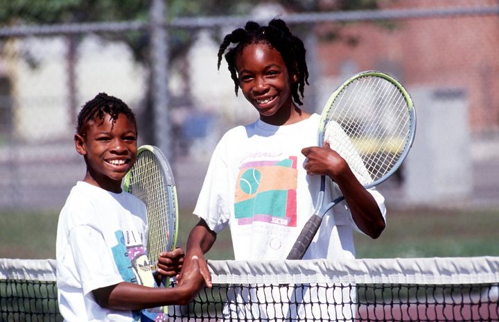 Sisters Serena, left, and Venus Williams shake hands after a game in 1991.