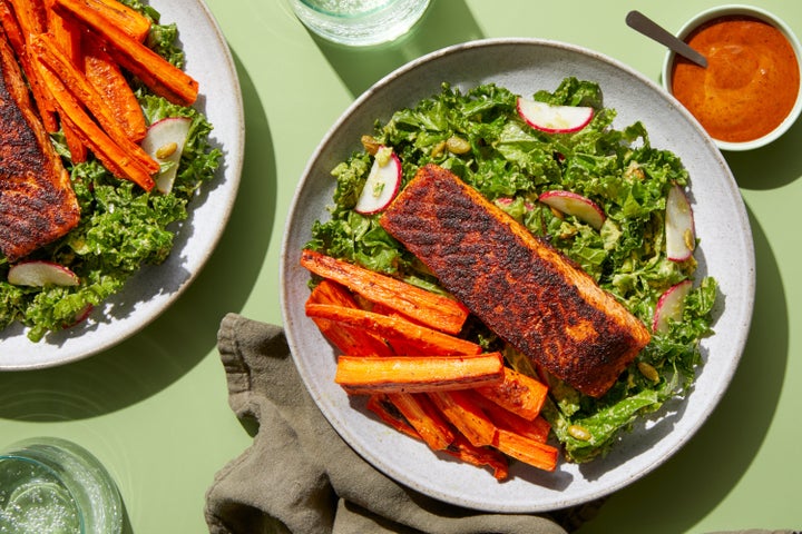 A tasty Blue Apron Whole30 meal of spice-crusted salmon and carrot fries with avocado-kale salad and chipotle dipping sauce.