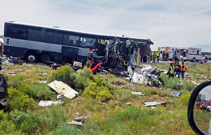 First responders work the scene of a collision between a Greyhound passenger bus and a semi-truck on Interstate 40 near the town of Thoreau NM near the Arizona border Thursday Aug 30 2018